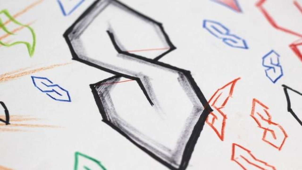 The Universal “S”: The Doodle That Refuses to Die